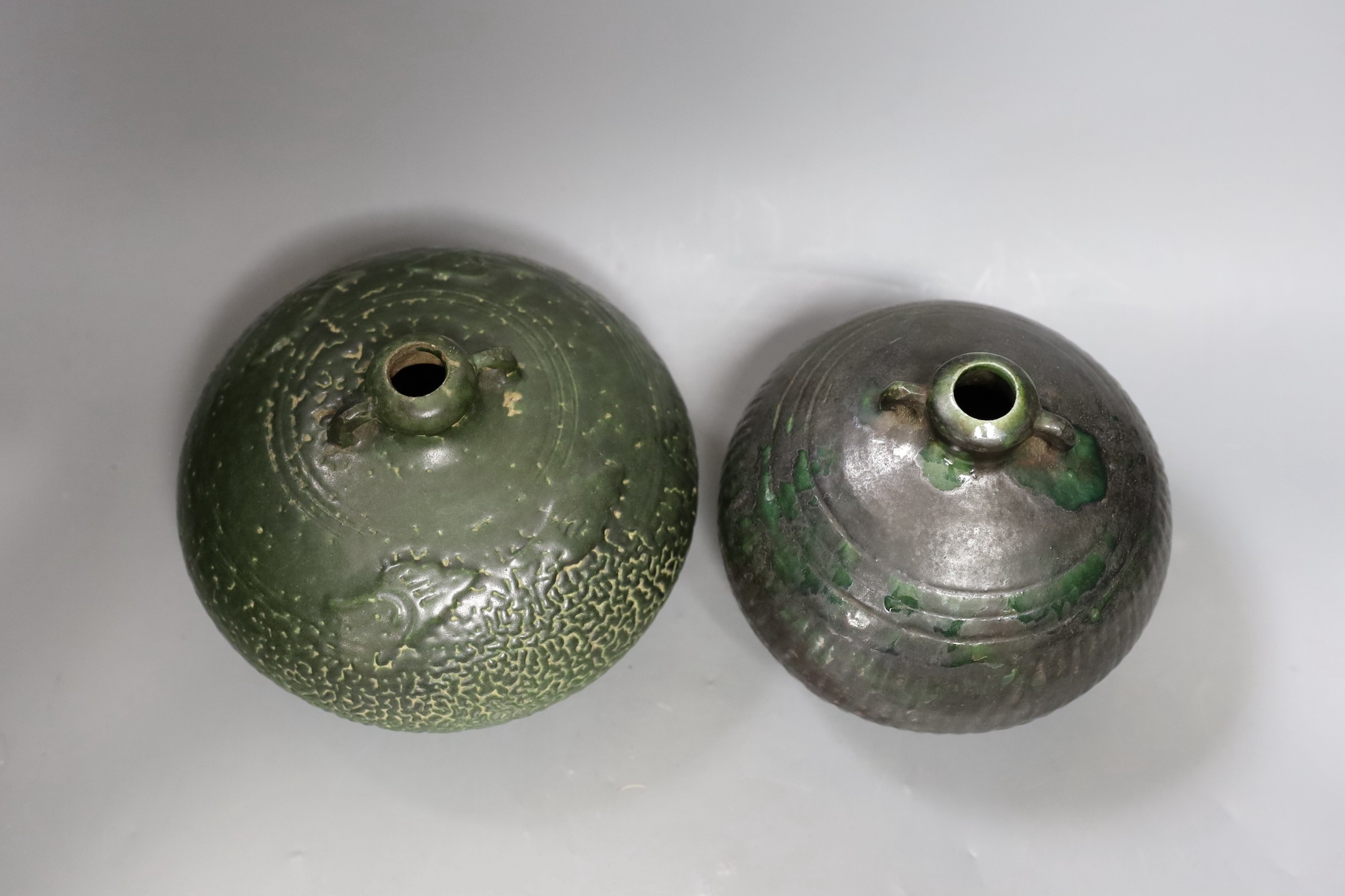 Two Thai Sawankhalok green-glazed ring handled jars, 15th-16th century, tallest 15.5cm